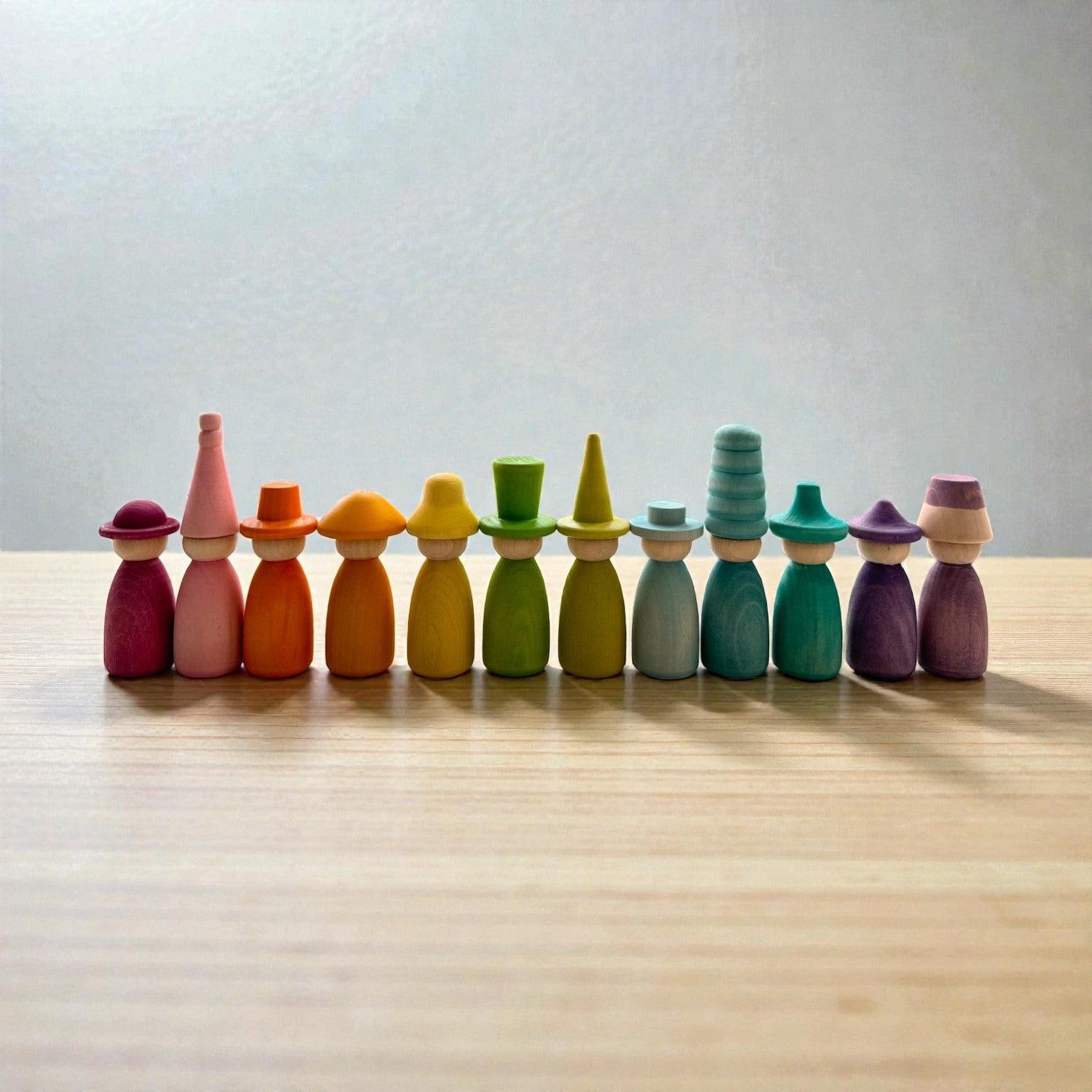 12 Piece Pastel Macaron Wooden Peg Dolls with Interchangeable Hats Open Ended Play Figures - Image 8